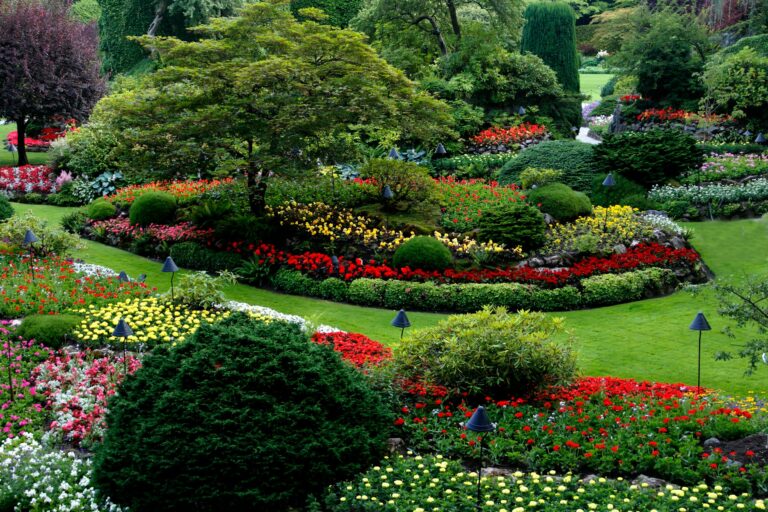 Beautifully landscaped garden with colorful flower beds and manicured greenery