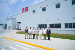 FNG Vice Chairman Yusuke Hirano; General Trias City Mayor Luis “Jon-Jon” Ferrer; Embassy of Japan in the Philippines Minister for Economic Affairs Yokota Naobumi; FNG Chairman Alfred Ty; UNIQLO Chief Operating Officer Geraldine Sia; Congressman Antonio “Ony” Ferrer; and FNG President Thomas Mirasol standing in front of the UNIQLO Logistics Facility